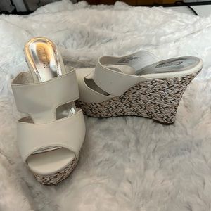 These are Jennifer Lopez 4” white sandals worn twice. asking $20.00